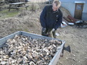 Martin fillning sacks with wood.